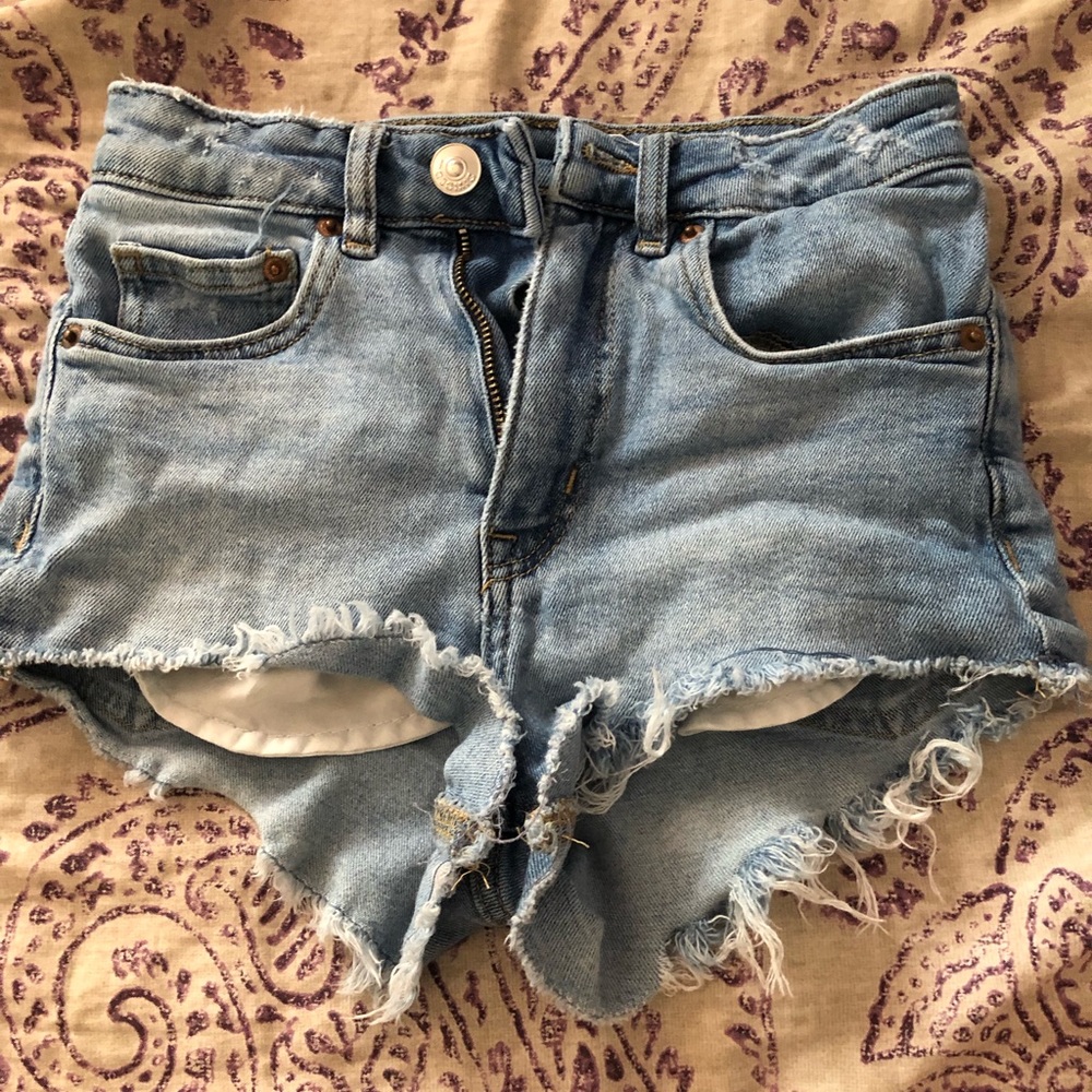Light blue distressed jean shorts.